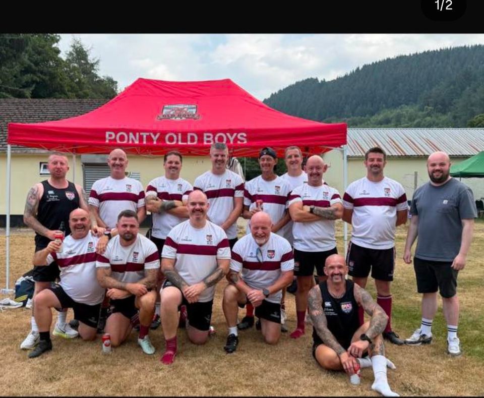 The Ponty Old Boys touch rugby squad in red and white hoops in front of their gazebo